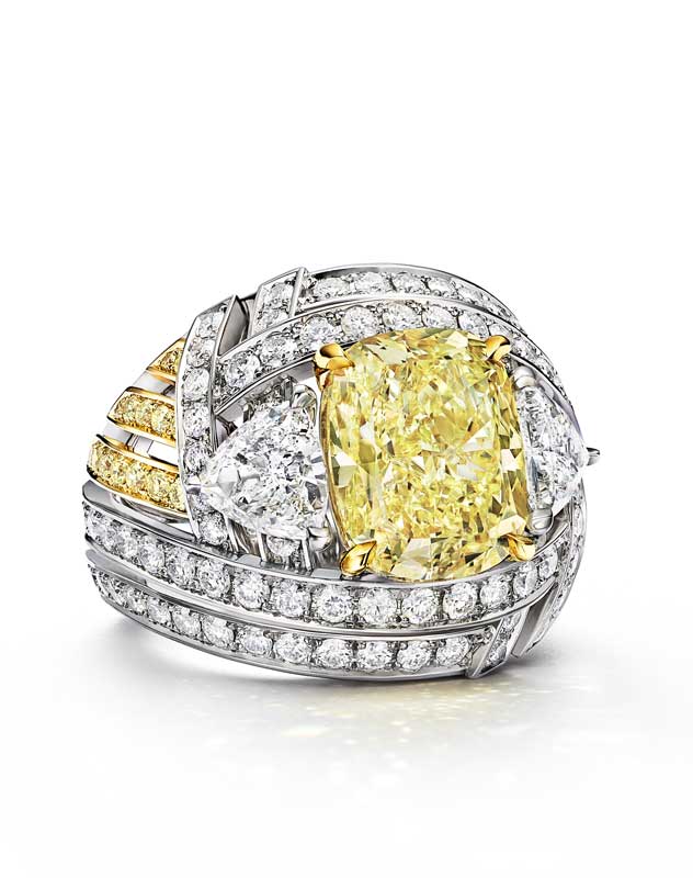 Amura,AmuraWorld,AmuraYachts, Nest Ring with a Fancy Yellow diamond: A ring crafted in platinum and 18k yellow gold, featuring a Fancy Yellow diamond weighing over six carats, accented by white diamonds and yellow diamond details.